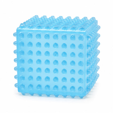 SensoFlex sensory squeeze cube toy in bright green; pink SensoFlex anti-stress squeeze cube on display stand; blue textured squeeze cube sensory toy; SensoFlex squeeze cube held in hand; textured sensory cube toy with raised bumps; pink blue and bright green SensoFlex squeeze cubes; anti-stress squeeze cube display of 12; SensoFlex tactile fidget toy